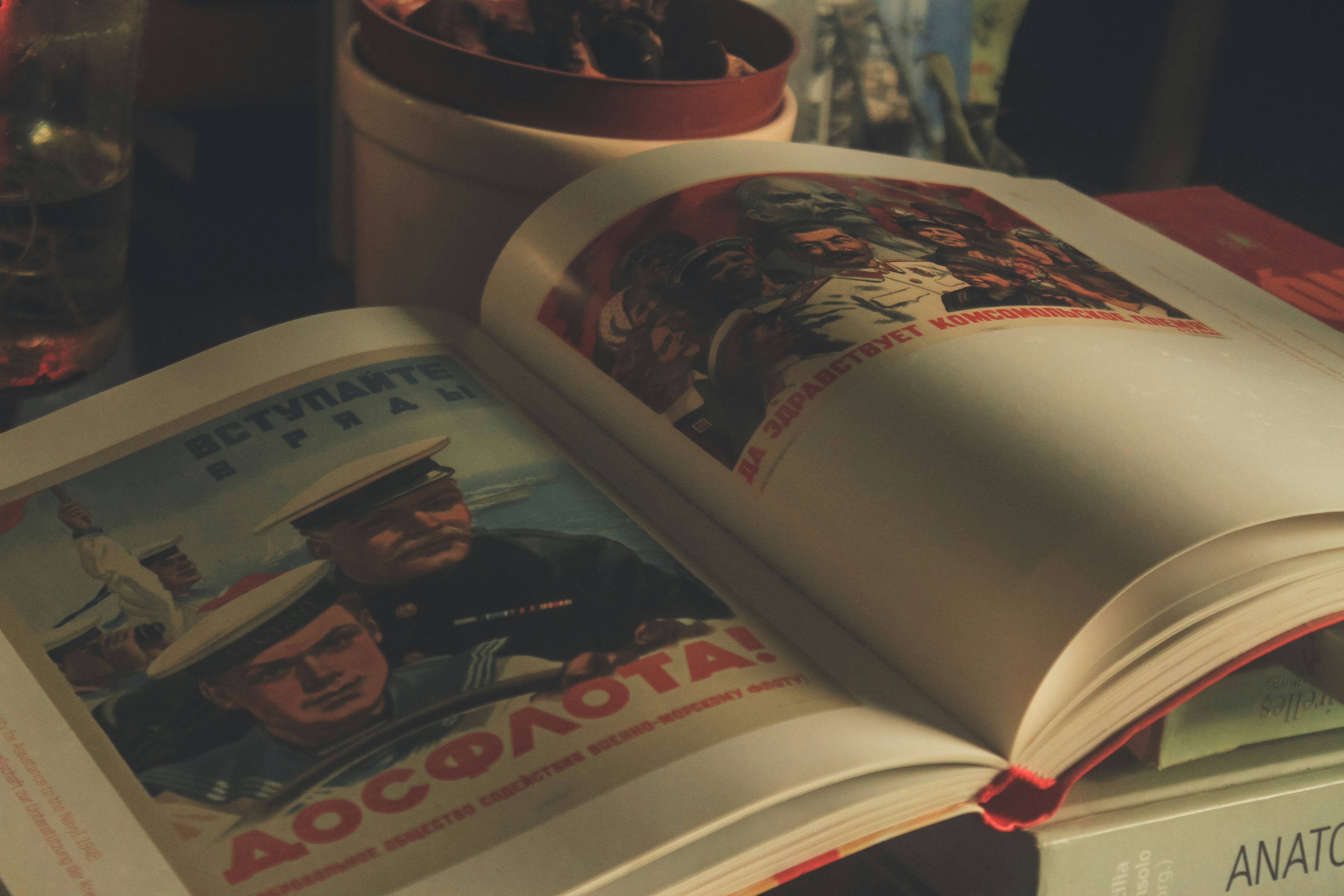 Dramatic film still showing open book transforming into cinematic scene with warm lighting and depth of field